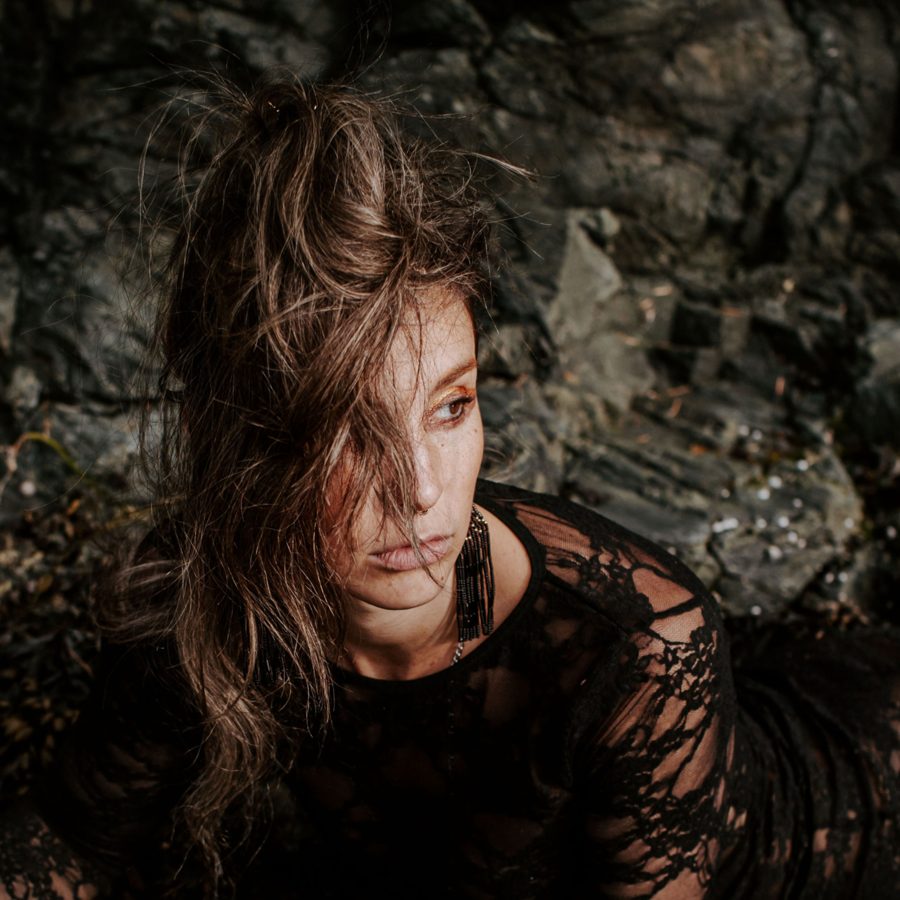 Corinne Donnelly among dark rocks